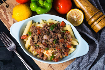 Beef spaghetti,There are plenty of tomatoes and chopped beef on it.