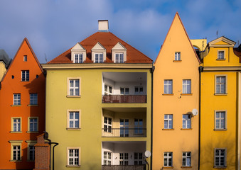 Fototapeta na wymiar Colorful polish apartment buildings with pointy roofs