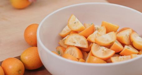Cut of kumquat by knife