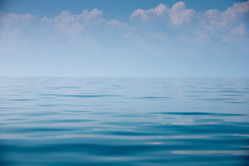 Fototapeta premium Beautiful sky and blue smooth ocean.