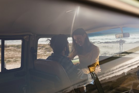 Couple embracing in vehicle