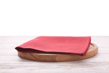 Pizza board, with napkin on wooden table isolated. Top view mockup