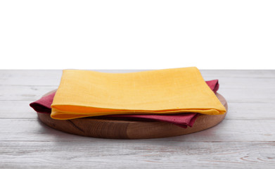 Pizza board, with napkin on wooden table isolated. Top view mockup