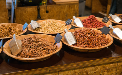 desk in a shop with all kinds of nuts