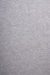gray knitted background, close-up of grey knitwear sweater