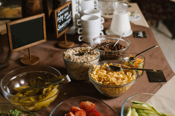 Different flakes in glasses on the buffet table