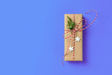 Christmas gift boxein front of blue background with copy space