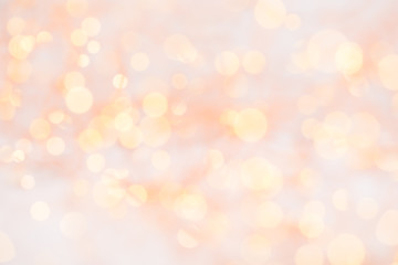 Obraz premium Christmas greeting card. Christmas tree branch on glitter golden bokeh lights background. New Year concept. Copy space.