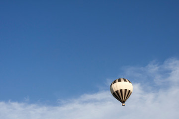 Hot air balloon floating in the air / Airborne hot air balloon with copy space.