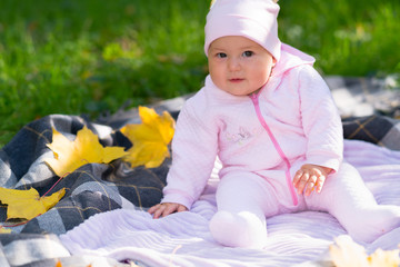 Inquisitive little baby girl staring at the camera