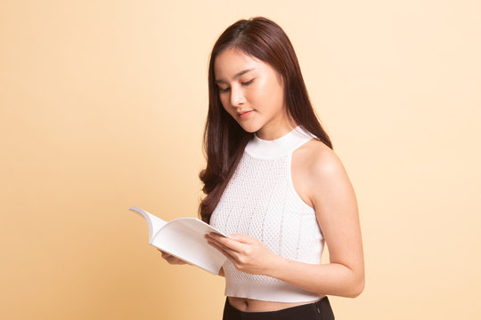 Young Asian woman read a book.