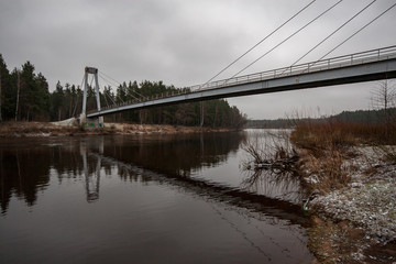 wooden and composite material foot bridge over water
