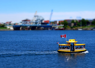 Tilt shift miniature photo of a water taxi in Victoria, British Columbia