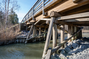 wooden and composite material foot bridge over water