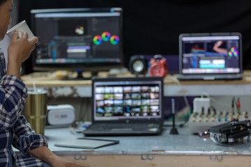 Relaxation of editor and use laptop and computer editing video create content upload to social...