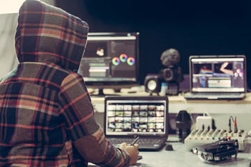 Editor working use laptop and computer editing video create content upload to social media on...