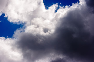 dense and great white clouds on a beautiful summer blue sky