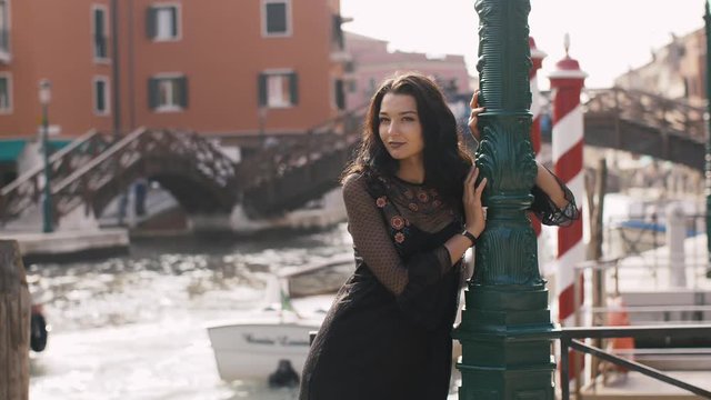 Romantic tourist couple in love in Venice, Italy on Piazza, San Marco. Happy young couple on travel vacation. Beautiful woman, handsome man in slow motion 4K UHD footage