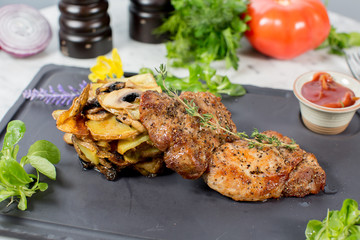 grilled chicken with vegetables on white plate