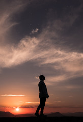 Obraz premium Fantastic sky sunset with one person