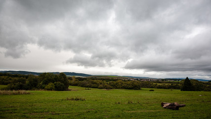 Obraz premium cloudy and misty Slovakian Western Carpathian Tatra Mountain skyline covered with forests and trees