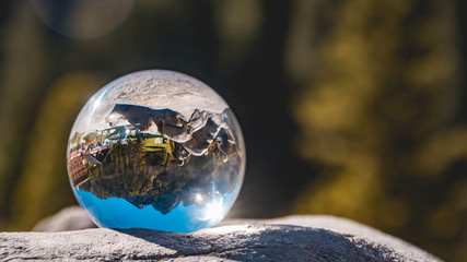 Crystal ball alpine landscape shot at the famous Gosausee-Salzburg-Austria