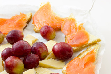 Salmon appetizer with grapes and cheese