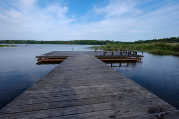 Obraz premium wooden and composite material foot bridge over water