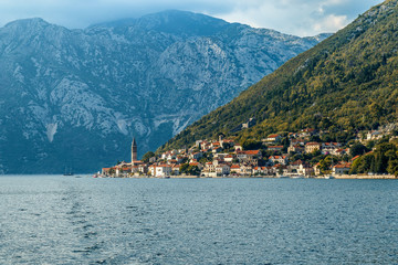 The city on a hillside overgrown with greenery on the beach