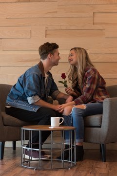Couple interacting with each other in cafe