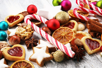 Decoration with christmas cookies. Typical cinnamon stars with fruits and nuts