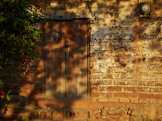 old brick wall with door