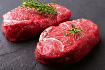 Two beef steaks with rosemary.Close-up