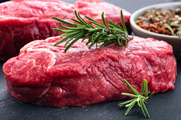 Two beef steaks with seasoning