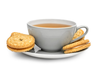 Cup of tea with sandwich cookies on on saucer. Isolated on white.