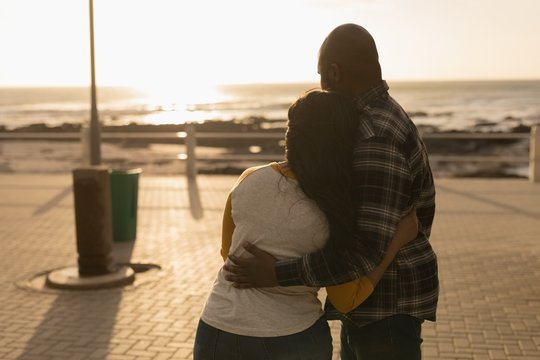 Couple embracing on promenade