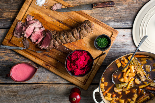 Overhead view of food on wooden table