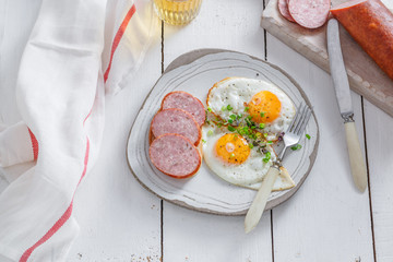 Sunny side up eggs with sausage and toast