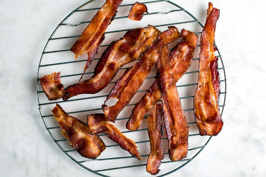Overhead view of bacon on cooling rack