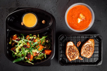 baked pear with nuts, tomato soup, salad with pumpkin, arugula and nuts. Healthy food delivery. Take away for diet. Fitness nutrition, vegetable, fruits in eco boxes.