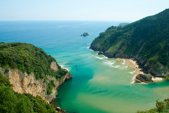 Secluded beach surrounded by amazing cliffs, Estuary of Tina Minor in Cantabria