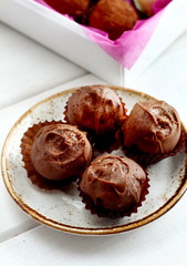Chocolate hand made candy on the white plate
