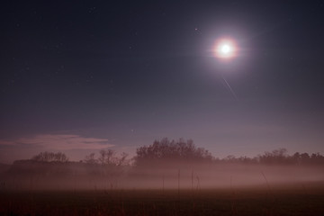 Naklejka premium Beautiful night view nature landscape with stars and fog environment in the countryside. Braunschweig, Germany