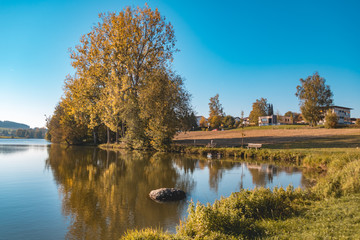 Beautiful autumn view with reflections at the Unteriglbach lake-Bavaria-Germany