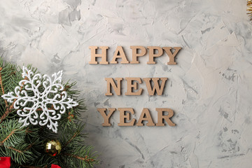 Fototapeta na wymiar New Year 2019. Christmas. Vacation. Composition with Christmas and New Year tree branches and the inscription Happy New Year. view from above