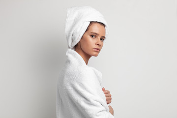 Obraz premium close up portrait of attractive sensual female with whit towel on head