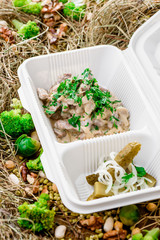 Mushrooms in creamy sauce. in a white box. Take with you