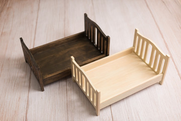 Fototapeta na wymiar little bed. crib for newborn photo shoot. children's bed. bed for dolls