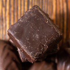 Chocolate candies on a wooden background. Close-up