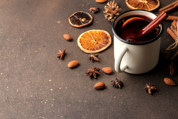 Hot mulled wine with cinnamon and orange on a dark background. Christmas. new Year.